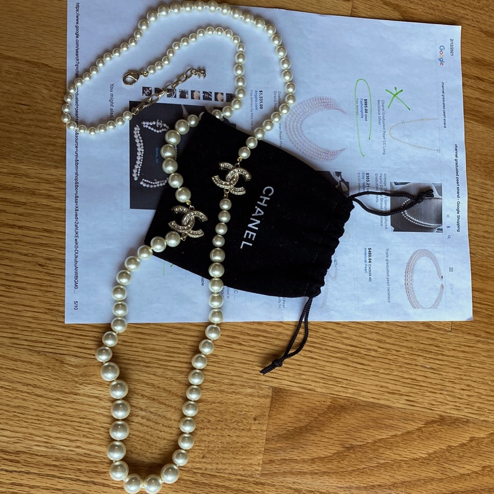Chanel pearl necklace with gold hardware. Beautiful piece, authentic with pouch.
